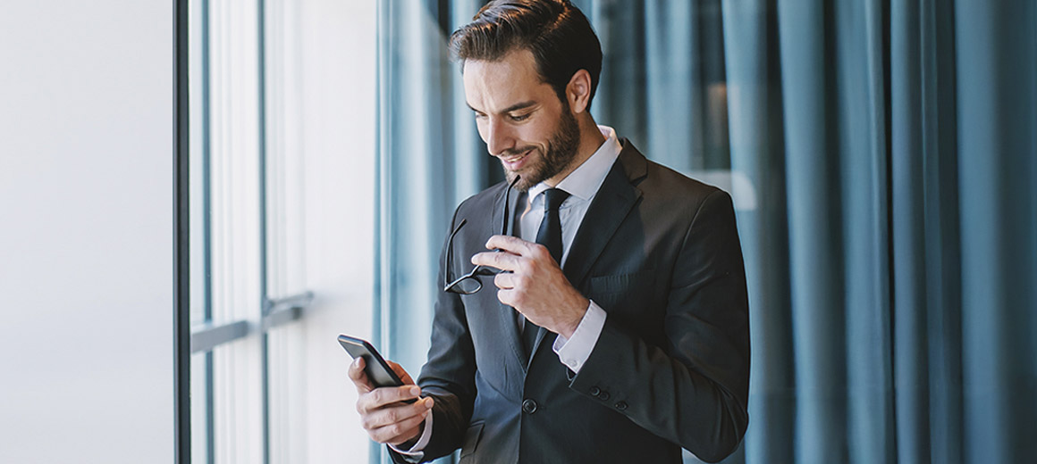 businessman looking at his phone