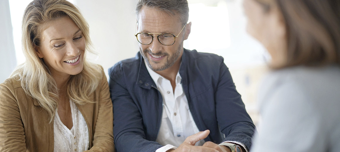 a couple meeting with a business person