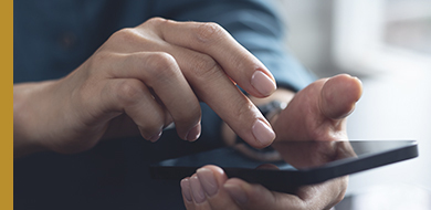 hands on a mobile phone