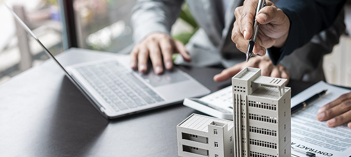 hands working on a building sample
